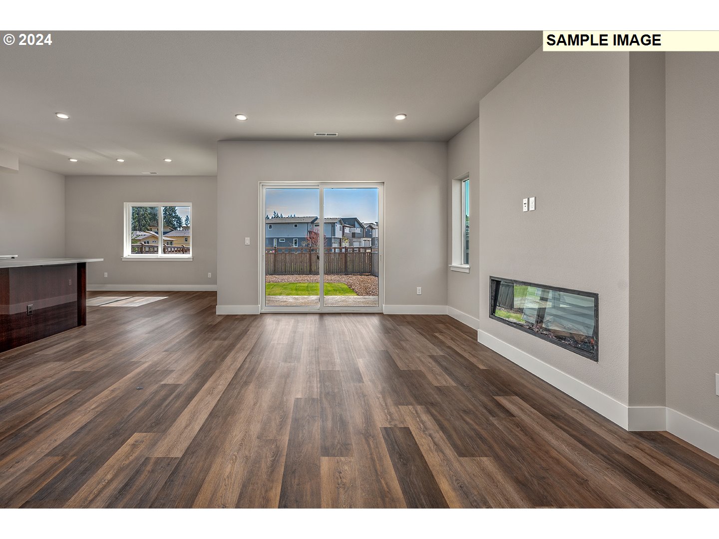 12343 Southeast Falling Rain Way Happy Valley, OR 97086 - Photo 8 of 39 view of an empty room with wooden floor and a window