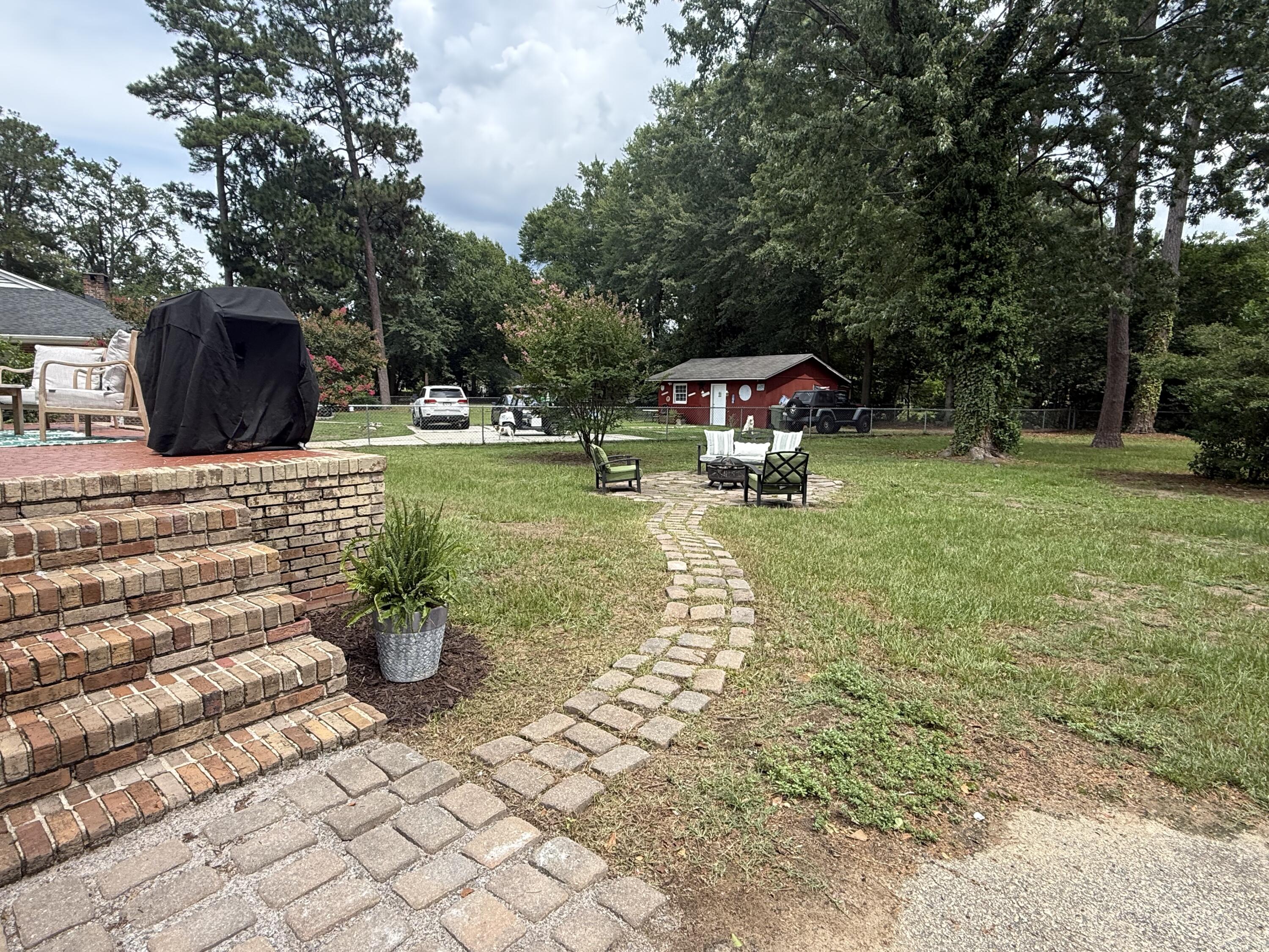 31 Riley Street Sumter, SC 29150 - Photo 14 of 65 Pathway to fire-pit and relaxing