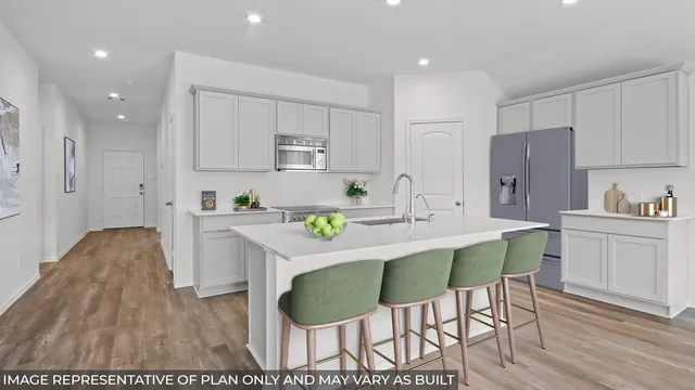 a kitchen with kitchen island wooden cabinets a stove a oven a white table and chairs