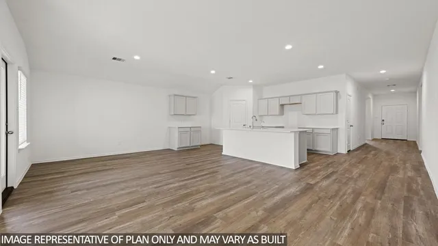 a view of kitchen with wooden floor