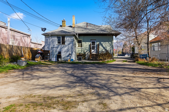 869 West Center Street Provo, UT 84601 - Photo 24 of 32 Rear view of house with a chimney and roof with shingles