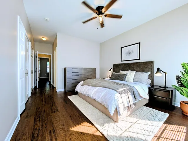 a bedroom with a bed and a chandelier