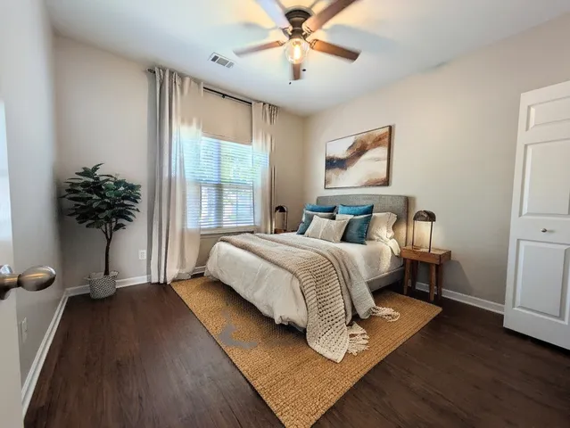 a bedroom with a bed and a window