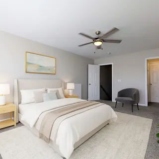 a bedroom with bed and a chandelier