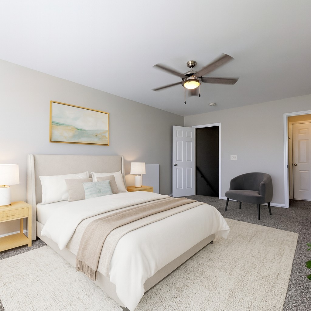 1101 Downs Boulevard, Unit 267 Franklin, TN 37064 - Photo 20 of 36 a bedroom with bed and a chandelier