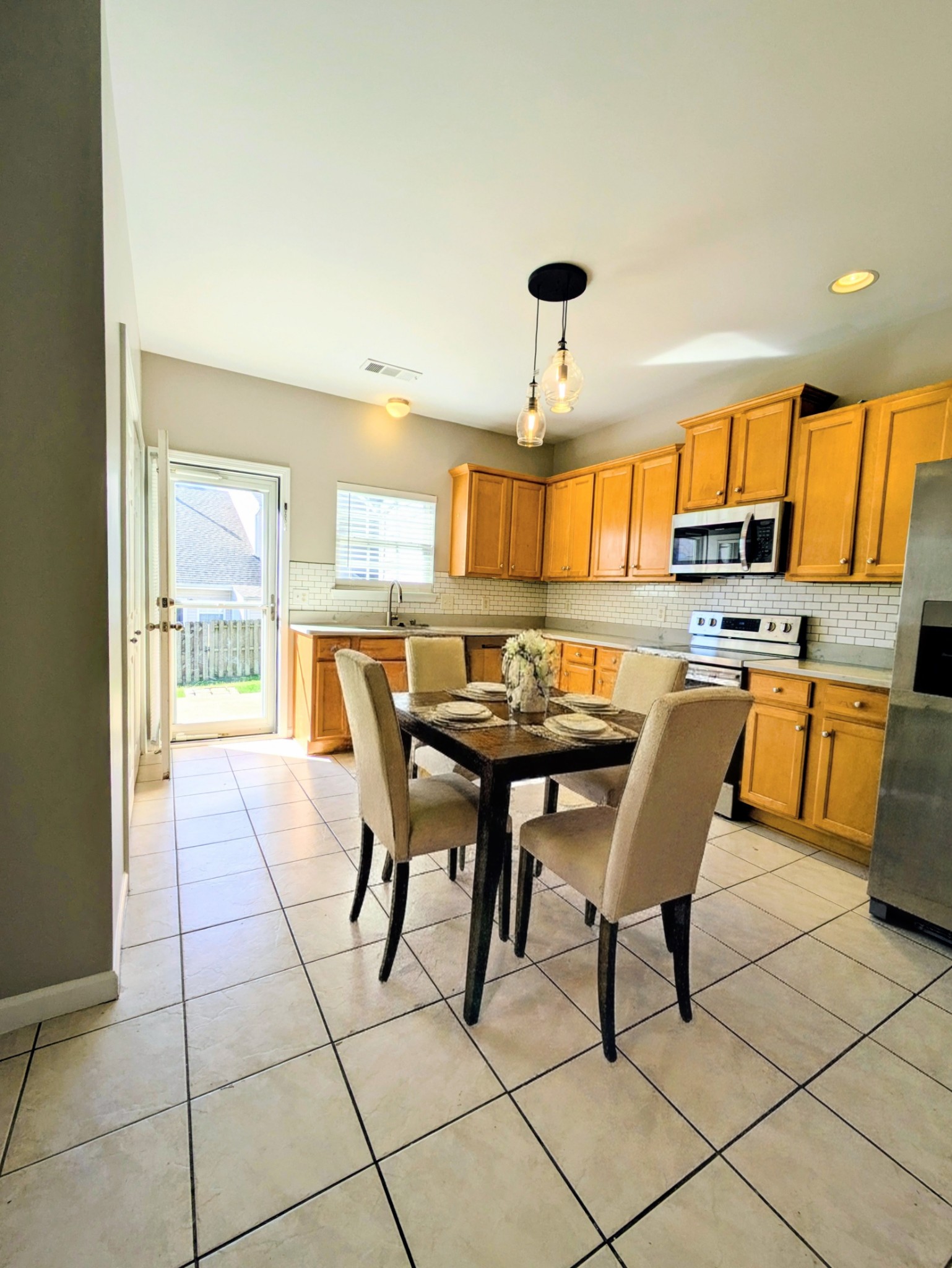1101 Downs Boulevard, Unit 267 Franklin, TN 37064 - Photo 23 of 36 a view of a dining room with furniture and a chandelier