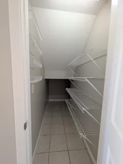 a view of an empty walk in closet
