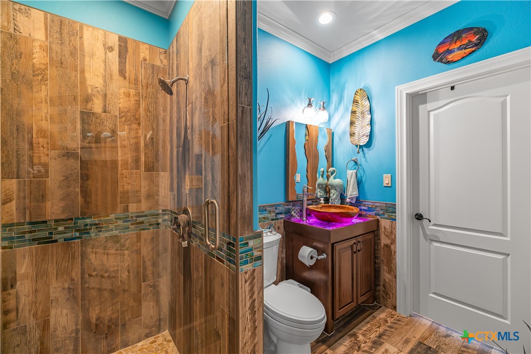 254 Sendera Loop Victoria, TX 77904 - Photo 39 of 48 a bathroom with a sink and mirror with toilet