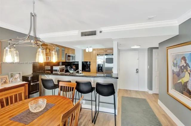 a living room with furniture wooden floor and a flat screen tv
