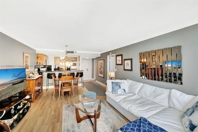a bedroom with a bed and a flat tv screen on dresser