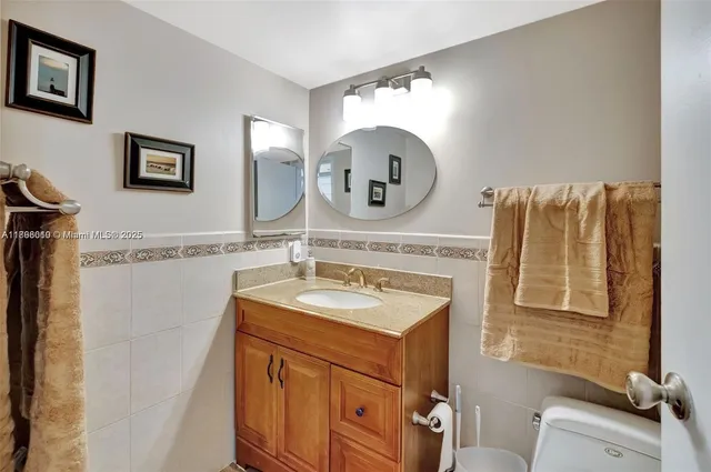 a bedroom with a bed and a night stand