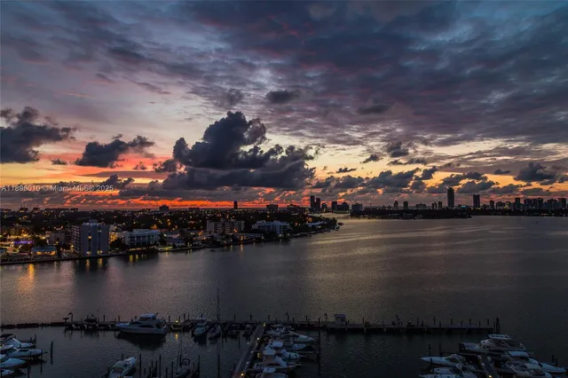 a kitchen with stainless steel appliances granite countertop a stove and a refrigerator