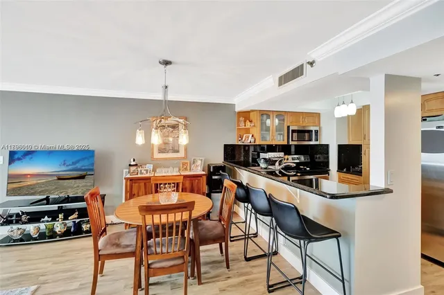 a kitchen with a sink and a stove top oven