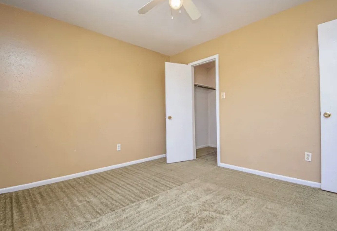 2000 4th Street Hempstead, TX 77445 - Photo 5 of 11 an empty room with a ceiling fan and a window