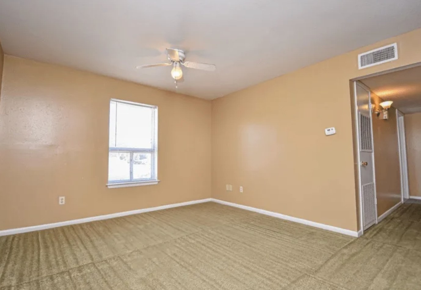 2000 4th Street Hempstead, TX 77445 - Photo 7 of 11 wooden floor in an empty room with a window