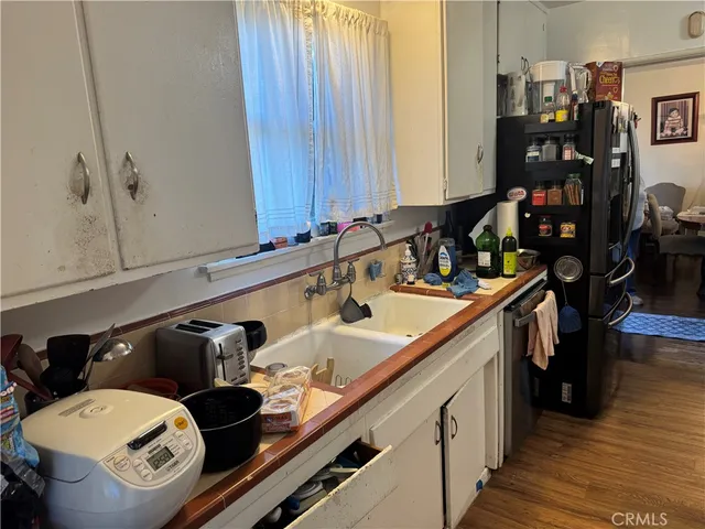 a bathroom with a glass shower door and a window