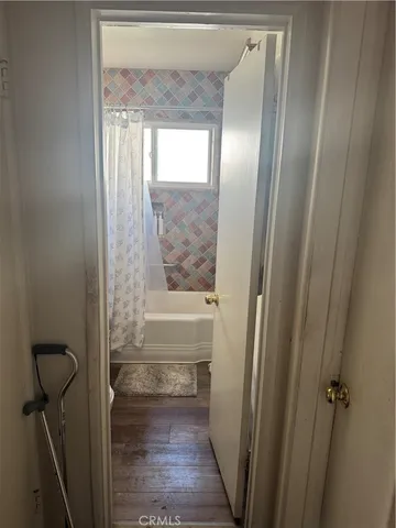 a bathroom with a sink mirror vanity and a shower