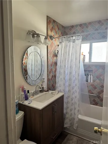 a view of a chair and table in backyard