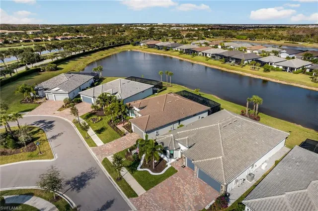 an aerial view of a house with a ocean view