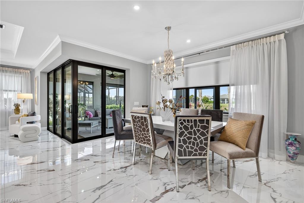 5687 Legendary Ln Avenue Immokalee, FL 34142 - Photo 10 of 50 a view of a dining room with furniture window and outside view