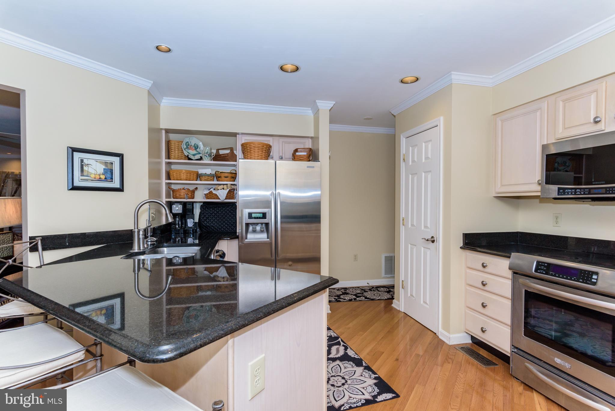 11 Drawbridge Road Berlin, MD 21811 - Photo 24 of 78 a kitchen with stainless steel appliances granite countertop a sink stove and refrigerator