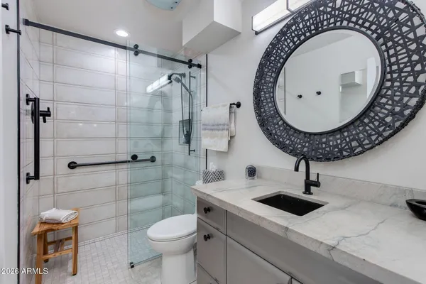 a bathroom with a double vanity sink and mirror