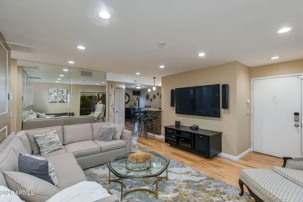 a living room with furniture and a flat screen tv