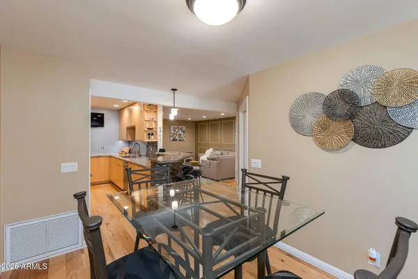 a view of a kitchen with a sink and a refrigerator