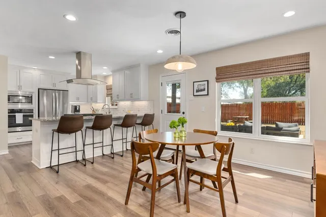 a view of a dining room with furniture window and outside view