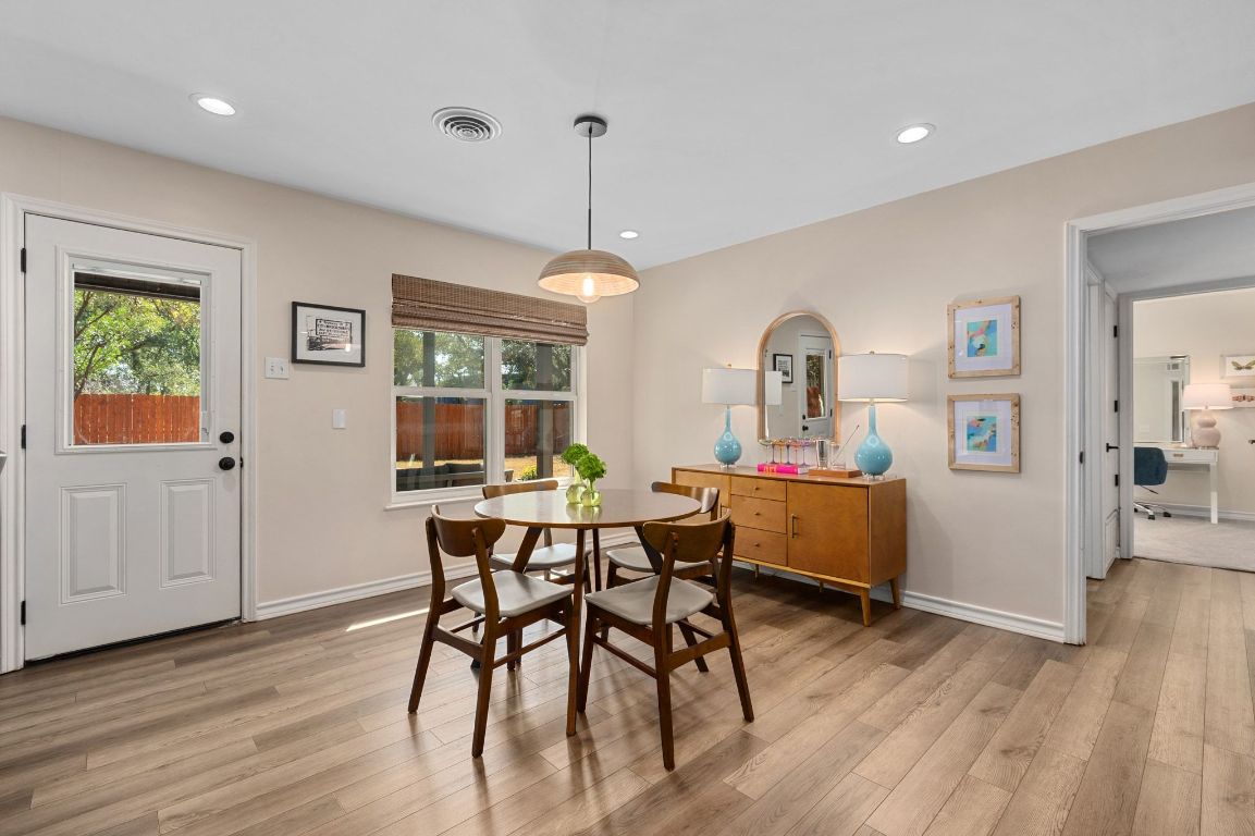 5605 Exeter Drive Austin, TX 78723 - Photo 13 of 32 a view of a dining room with furniture window and wooden floor