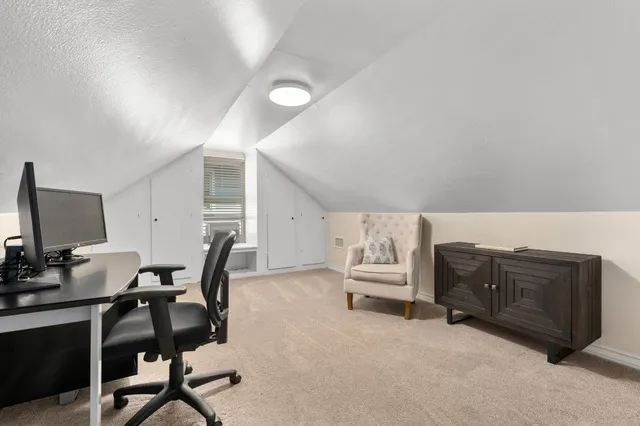 a bathroom with a granite countertop sink a toilet and bathtub