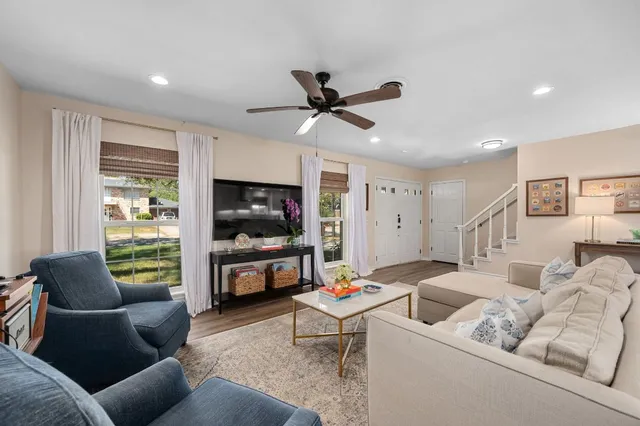 a living room with furniture and a flat screen tv