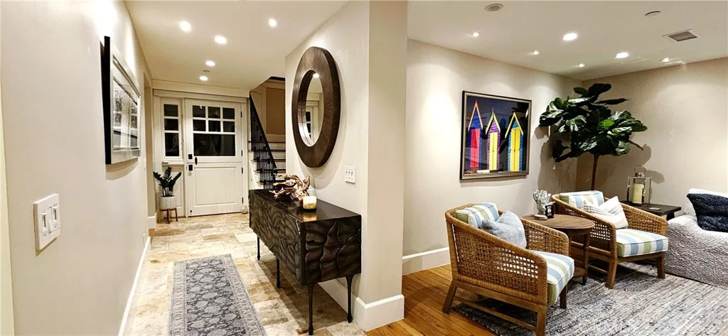 33925 Cape Cove Dana Point, CA 92629 - Photo 11 of 50 a living room with furniture a rug and a potted plant