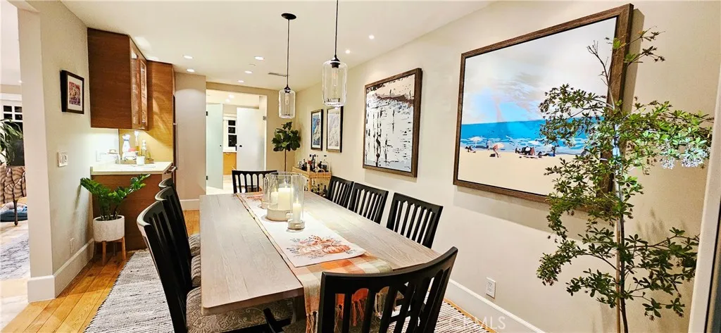 33925 Cape Cove Dana Point, CA 92629 - Photo 16 of 50 a view of a dining room with furniture and a potted plant