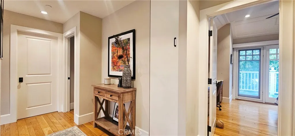 33925 Cape Cove Dana Point, CA 92629 - Photo 21 of 50 a view of a hallway with closet and wooden floor