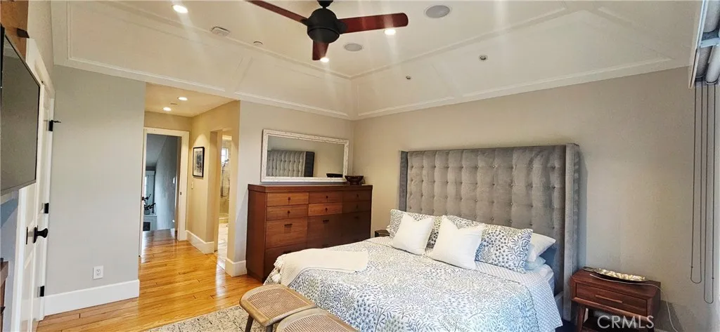 33925 Cape Cove Dana Point, CA 92629 - Photo 22 of 50 a bedroom with a bed and wooden floor