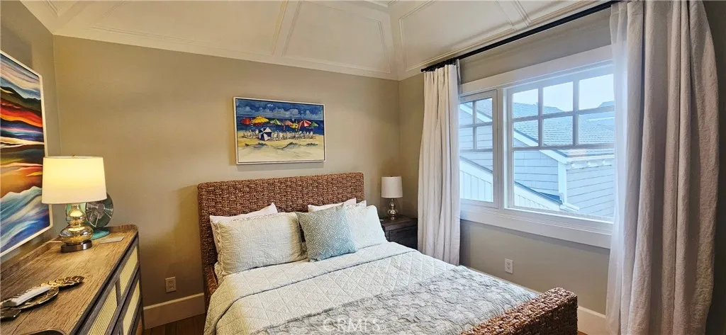 33925 Cape Cove Dana Point, CA 92629 - Photo 27 of 50 a bed room with a bed and a painting on the wall