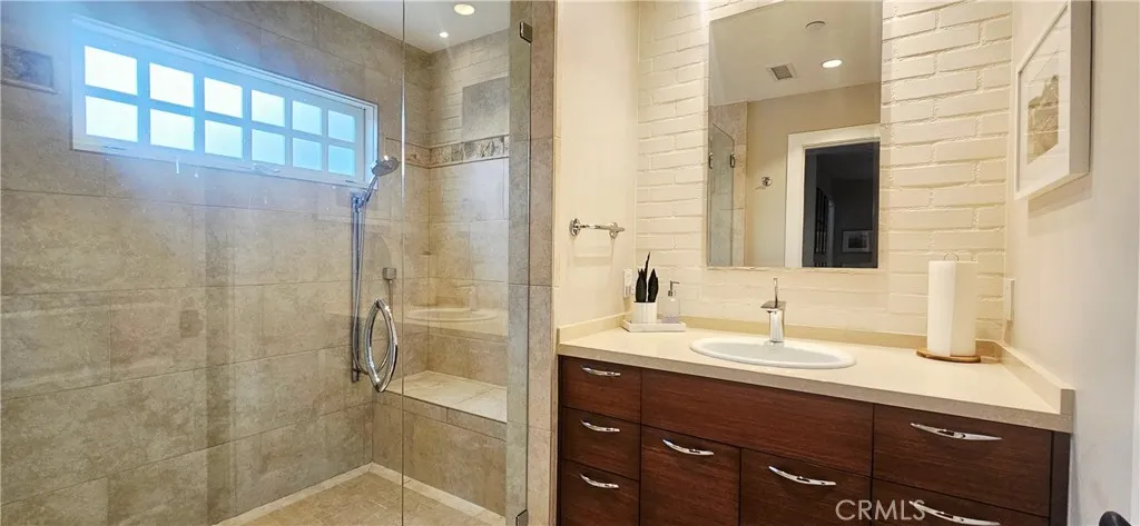 33925 Cape Cove Dana Point, CA 92629 - Photo 28 of 50 a bathroom with a sink and a mirror