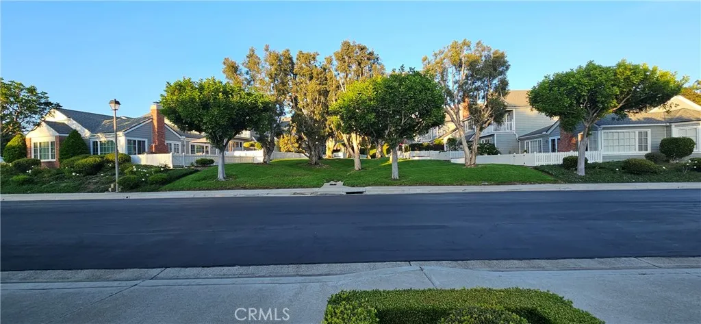 33925 Cape Cove Dana Point, CA 92629 - Photo 48 of 50 a front view of a house with a yard and garage