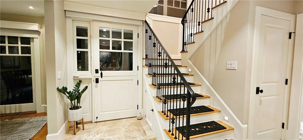 33925 Cape Cove Dana Point, CA 92629 - Photo 9 of 50 a view of staircase with wooden floor and a potted plant