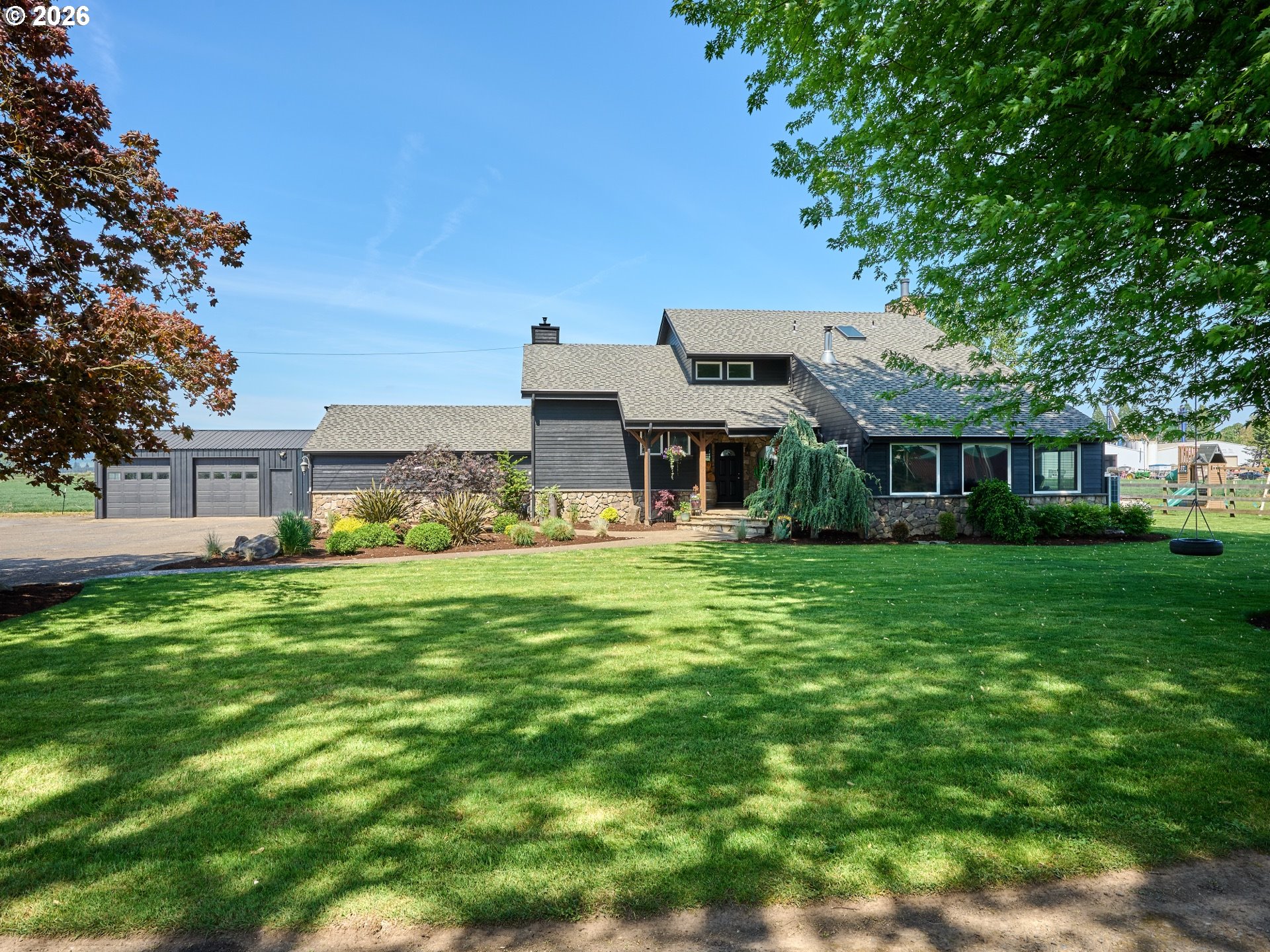 9293 Broadacres Road Northeast Aurora, OR 97002 - Photo 1 of 48 a view of a house with a big yard
