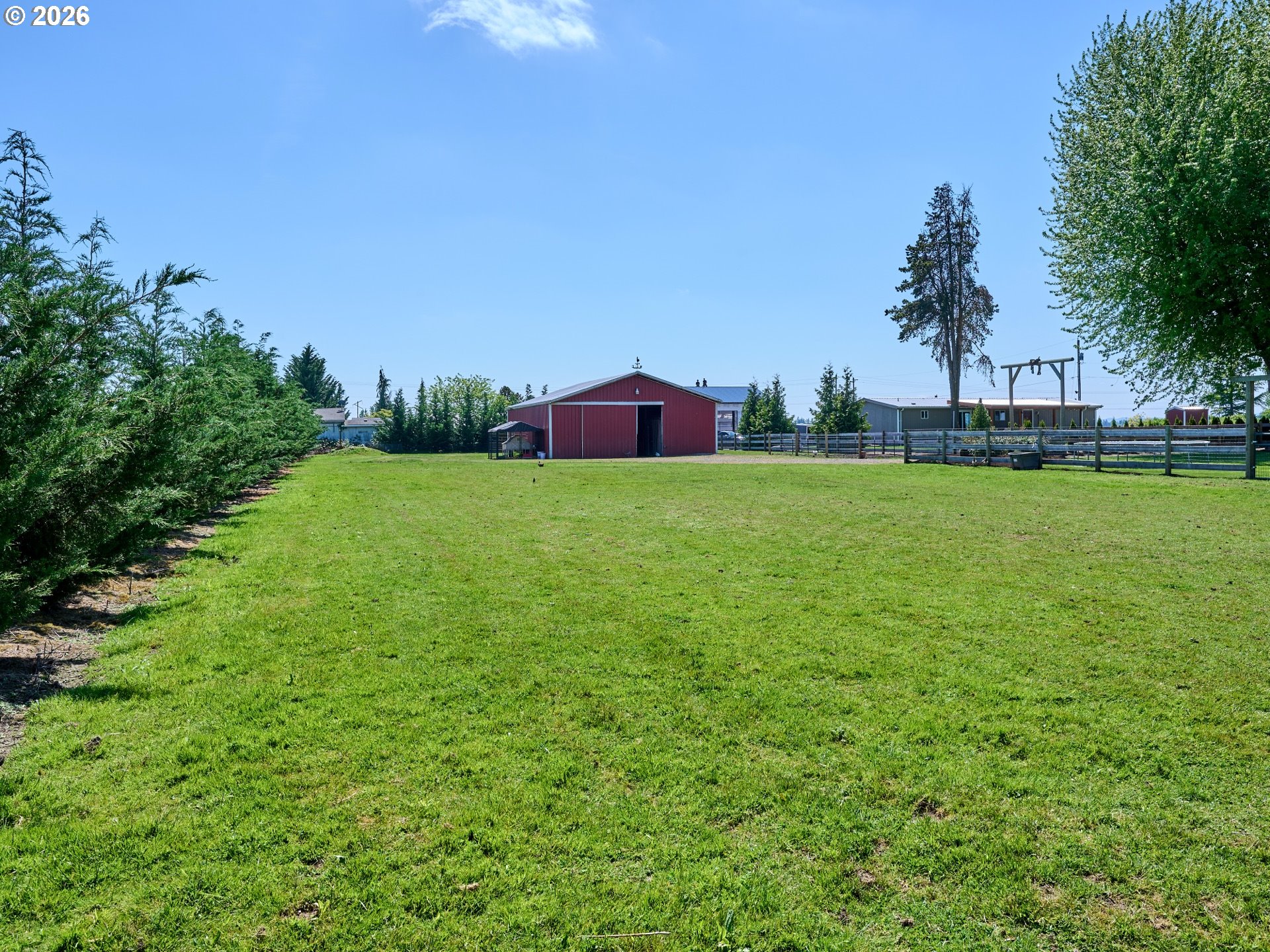9293 Broadacres Road Northeast Aurora, OR 97002 - Photo 42 of 48 a view of a large garden with plants and trees all around