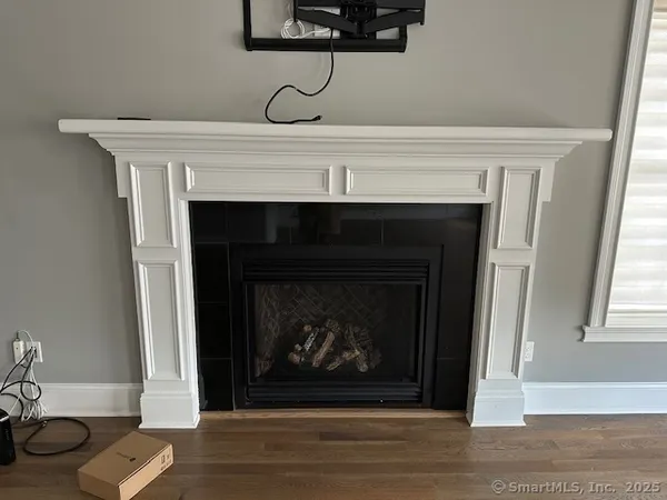 a living room with a fireplace and a fireplace