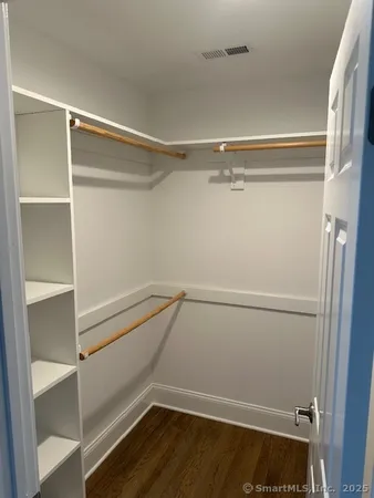 a view of an empty walk in closet