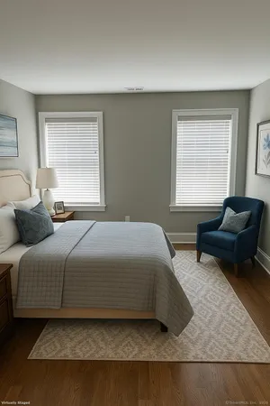 a bedroom with a bed and a couch