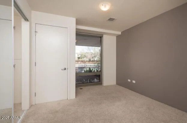 a view of an empty room and window