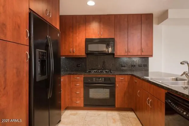 a kitchen with a stove microwave and sink