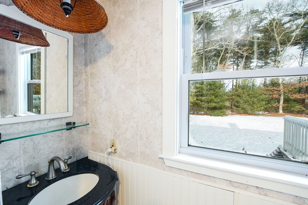 46 Service Road Sandwich, MA 02537 - Photo 13 of 35 a bathroom with a sink and a mirror