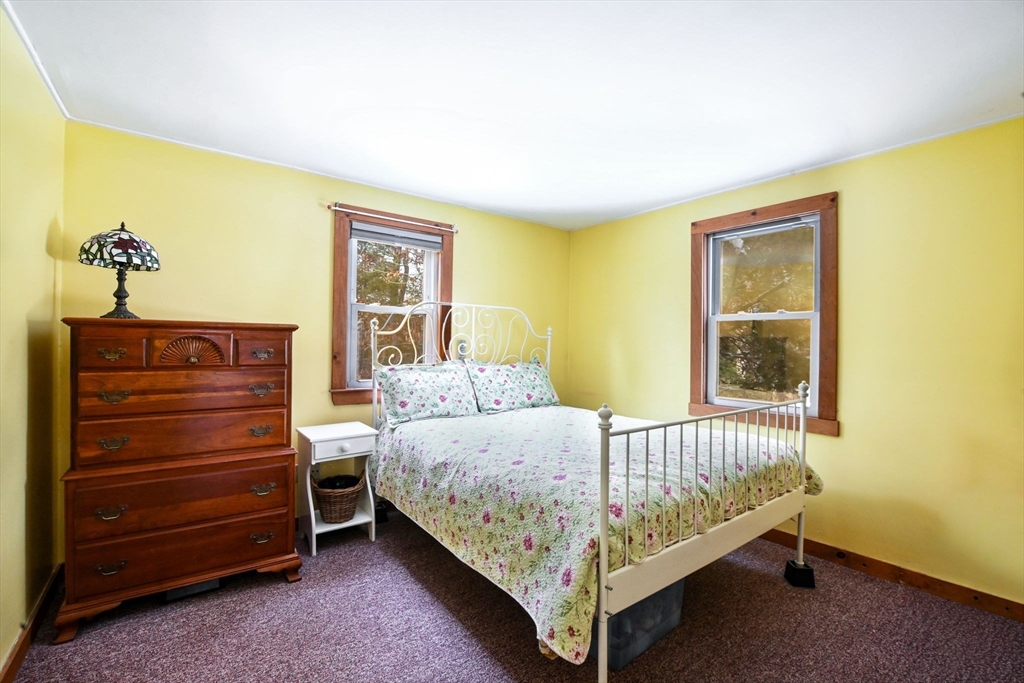 46 Service Road Sandwich, MA 02537 - Photo 15 of 35 a bed sitting in a bedroom next to a window