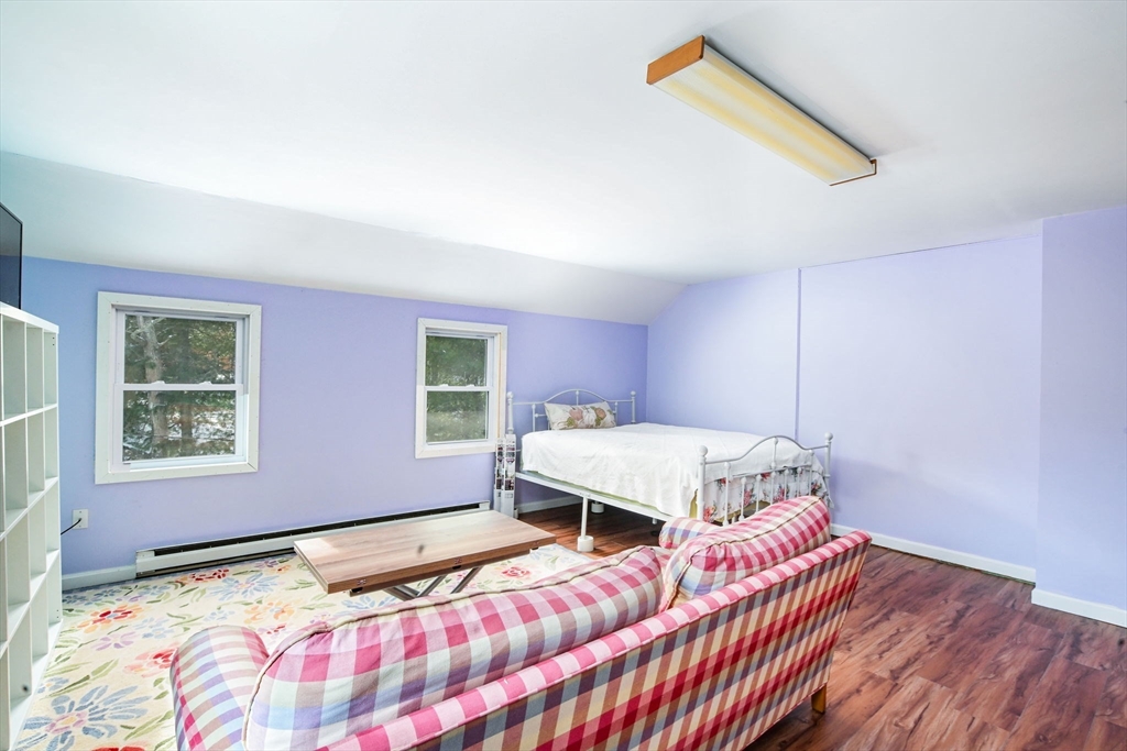 46 Service Road Sandwich, MA 02537 - Photo 17 of 35 a bedroom with a bed and wooden floor